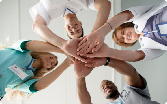 Healthcare professionals hands together